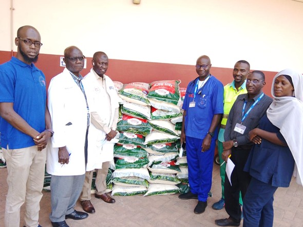 DR OMAR JAGNE DISTRIBUTES 150 BAGS OF RICE TO AFRICMED STAFF FOR RAMADAN