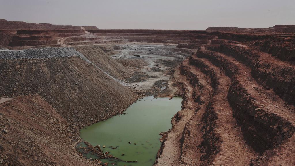 Terraced open-pit uranium mine in the arid landscape near Arlit, Niger