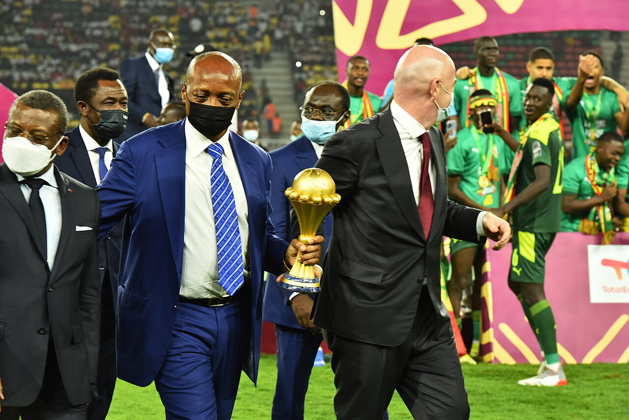 CAF president Patrice Motsepe and FIFA president Gianni Infantino holding the Africa Cup of Nations trophy in Cameroon in 2022