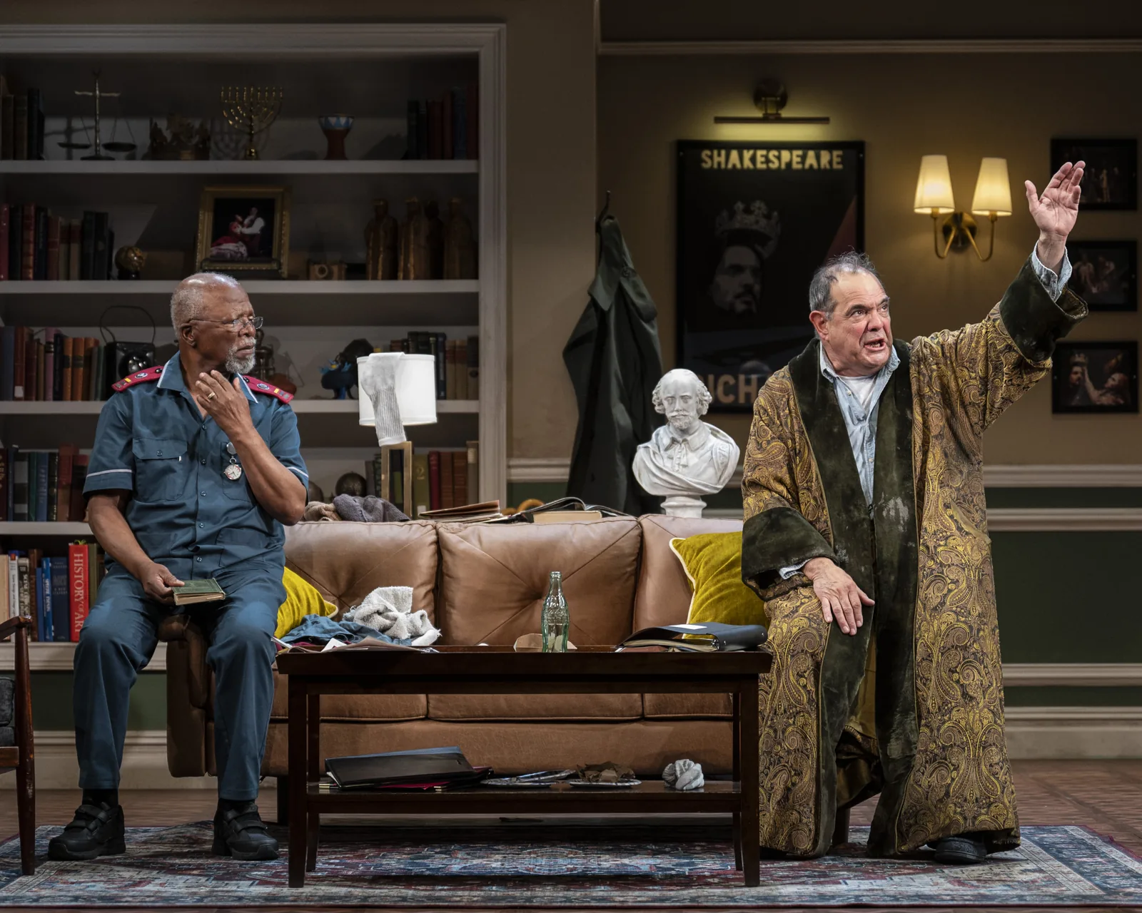 John Kani seated as Lunga Kunene, with Edward Gero standing as Jack Morris in Kunene and the King.